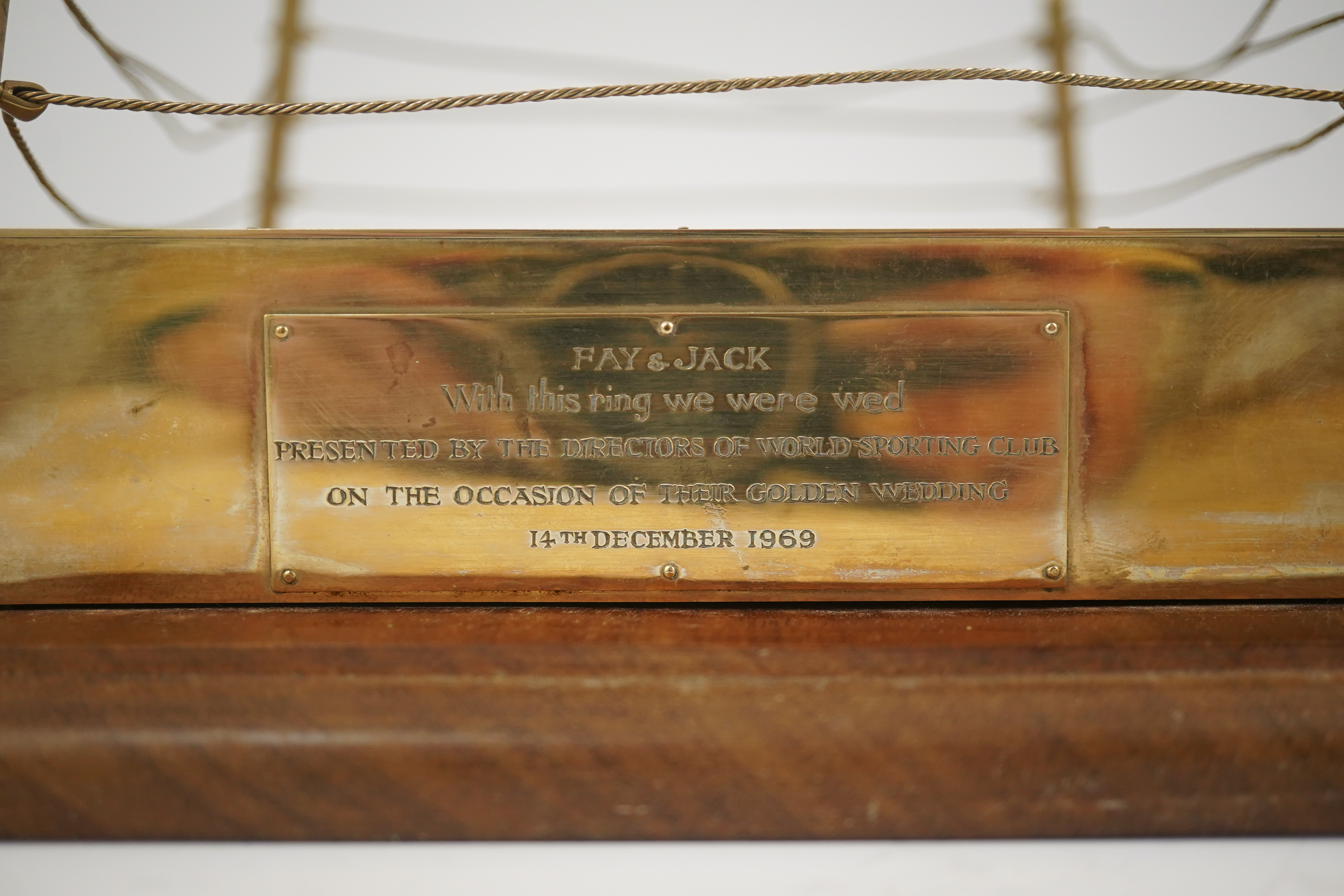 A late 1960's 9ct gold mounted Golden Wedding gift, presented to Jack & Fay Solomons from the Directors of World Sporting Club, modelled as a boxing ring